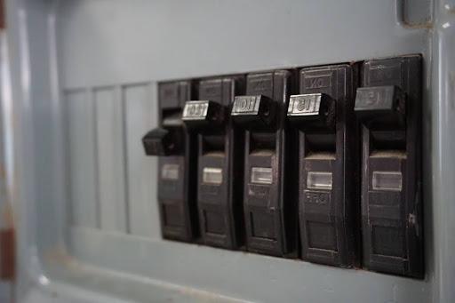 Circuit breakers on an electrical panel.